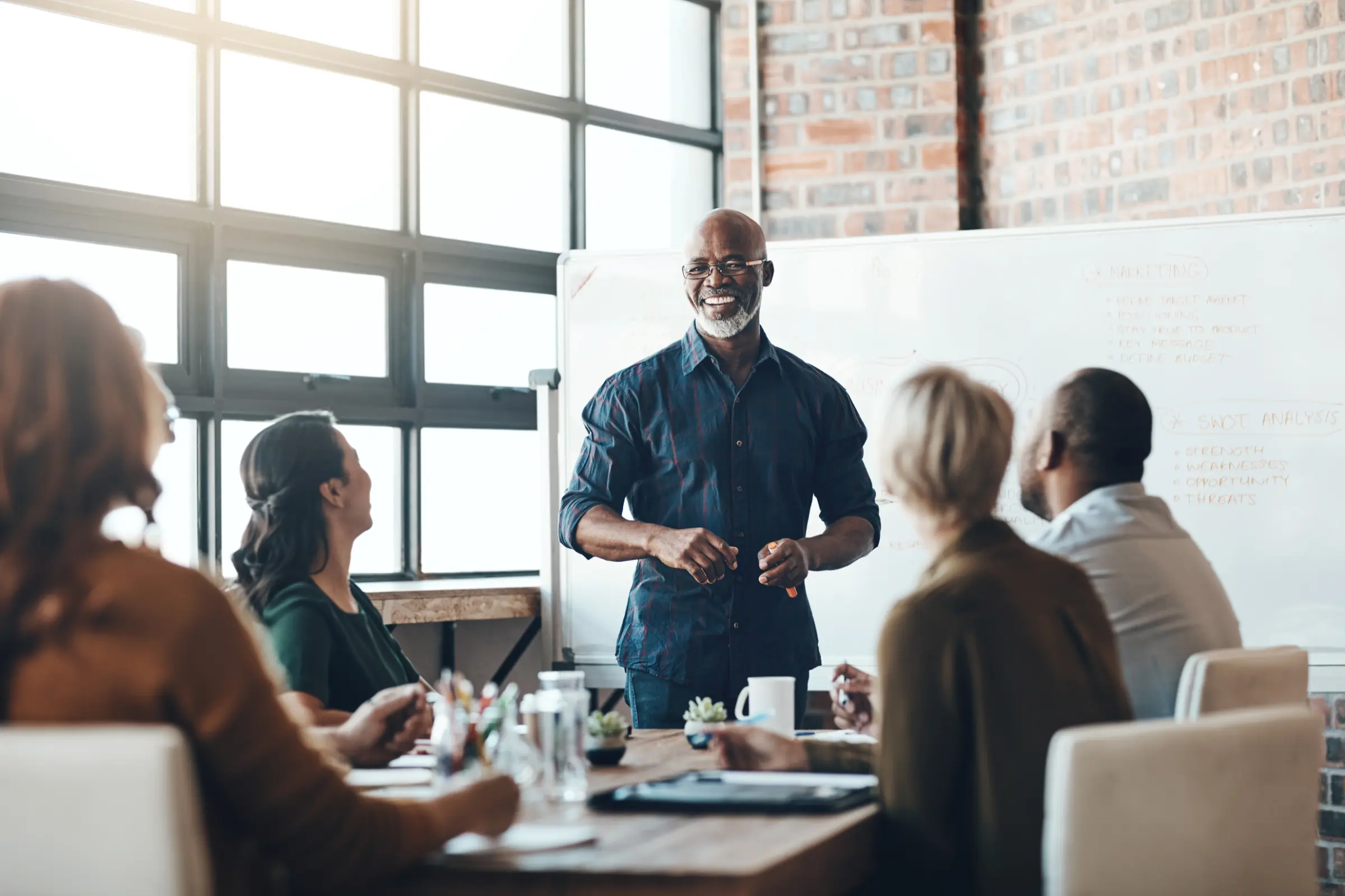 Shot of a businessman giving a presentation to his colleagues in a boardroom.