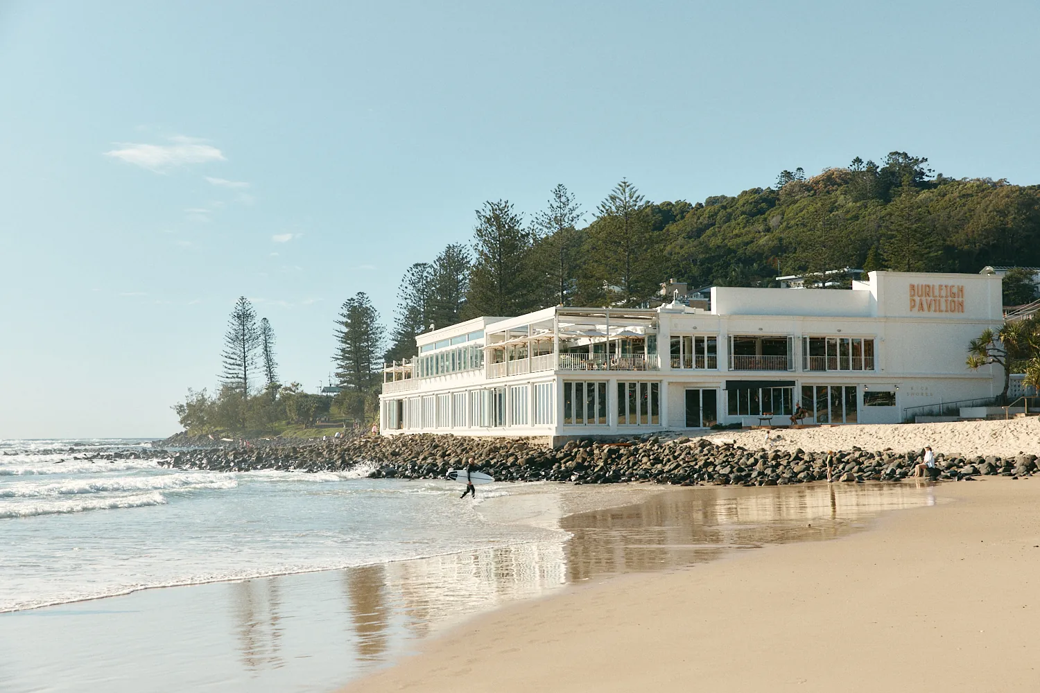 Burleigh Pavilion on the beachfront at Burleigh Heads, with the headland behind