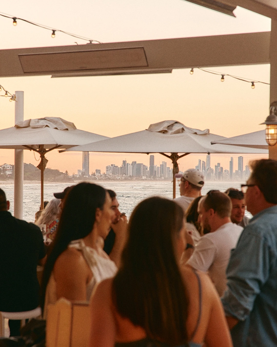 Guests gathered at a sunset event on the Burleigh Pavilion terrace
