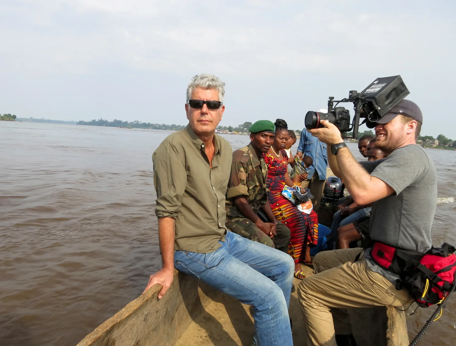 Anthony Bourdain and his film crew travel by boat on the Congo River.