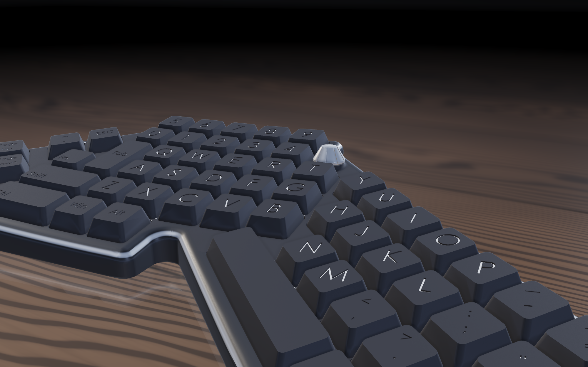 Close view of the volume knob standing proud of the keycaps at the end of the number row