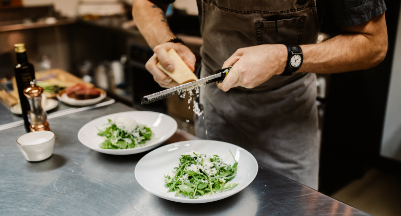 Chef plating a dish for a private dinner