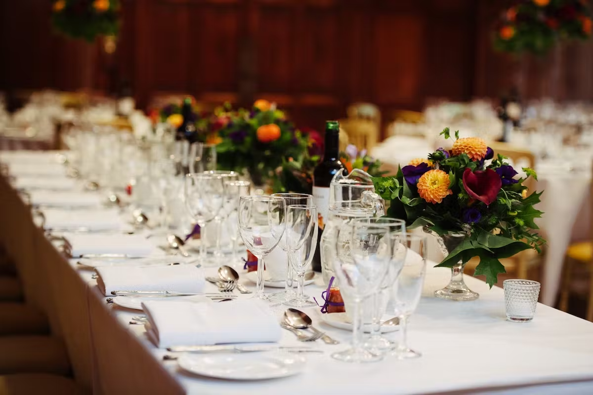 A corporate dinner laid in the Great Hall at Lanwades Hall
