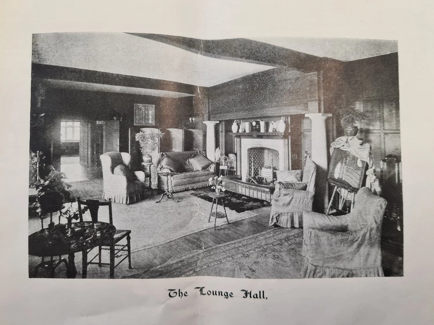 The wood-panelled lounge hall at Lanwades Hall
