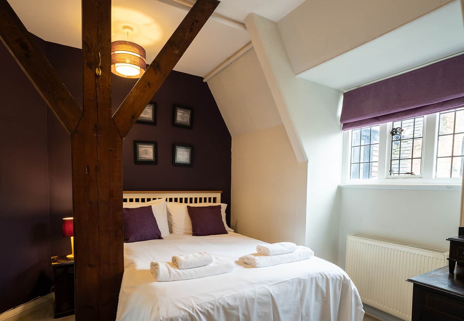 A cosy double bedroom under the eaves in the Attic Apartment at Lanwades Hall