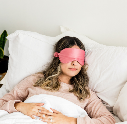 Woman sleeping with an eye mask