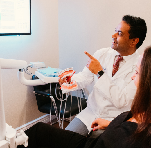 Dr. Aman Sidhu explaining preventive care to a patient in Henderson NV