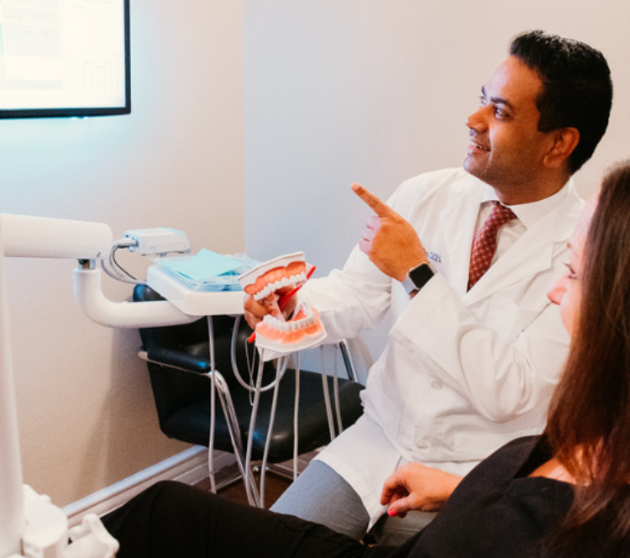 Dr. Aman Sidhu reviewing treatment options with a patient at Densley Dental in Henderson NV