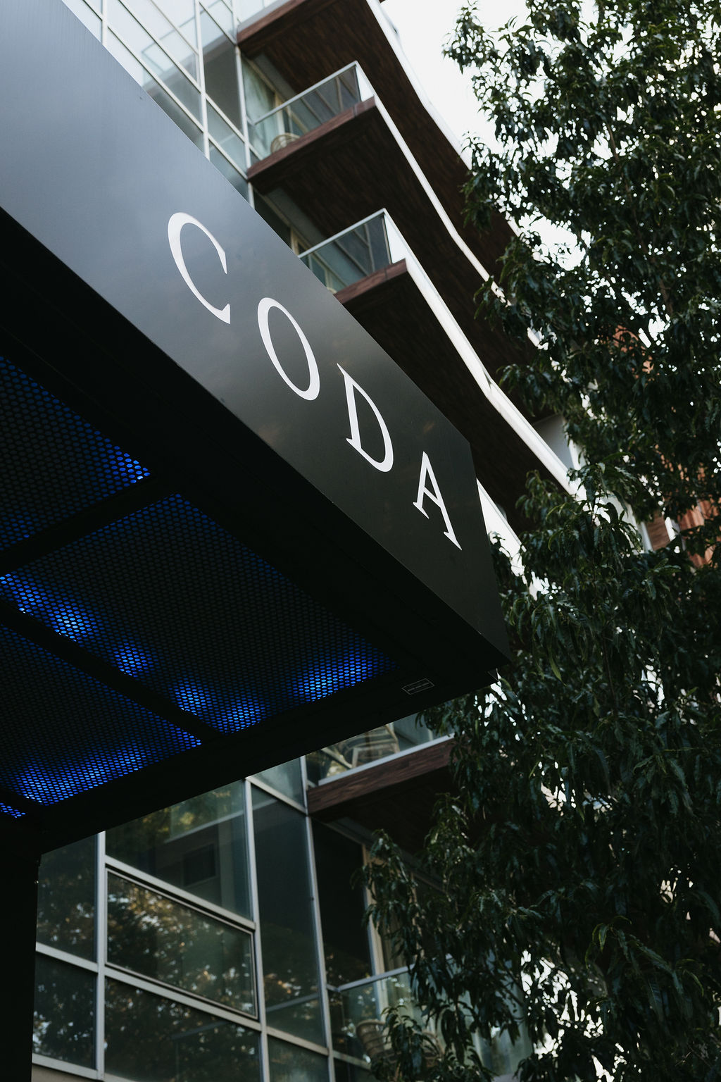 The CODA awning above the hotel entrance, seen from the street