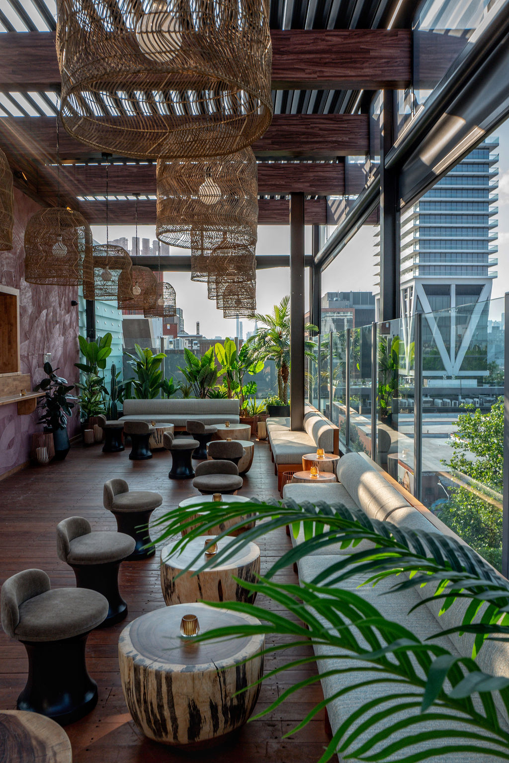 The rooftop lounge, with woven pendant lights and a view over Williamsburg
