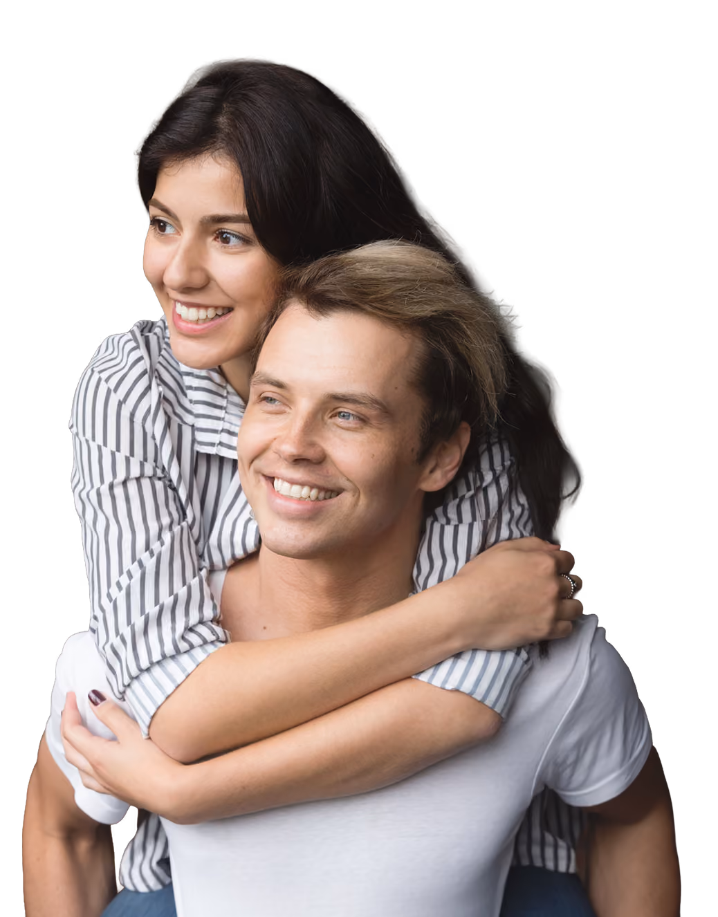 A smiling woman with dark hair hugs a smiling man with light hair from behind, both looking slightly to the side.