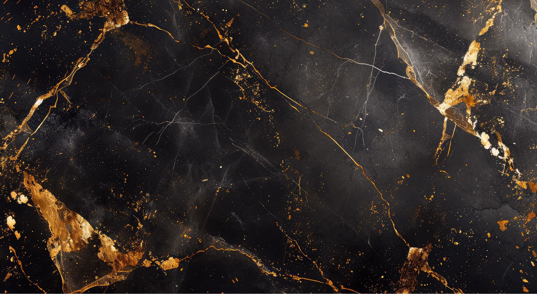 Black marble surface with natural golden and white veining and speckles creating an elegant, textured pattern.