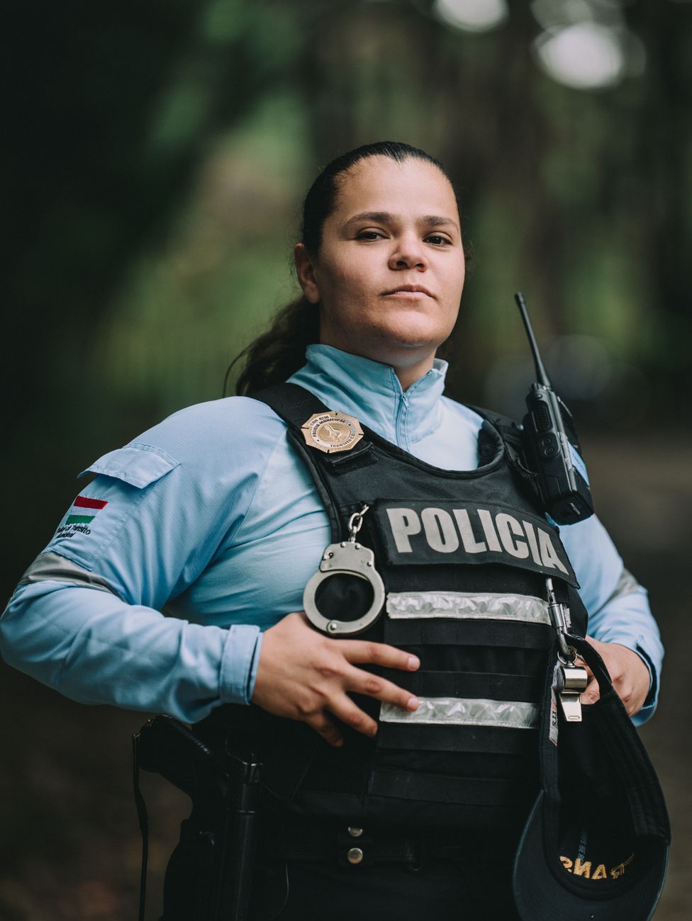 Portrait of a confident female police officer wearing a uniform outdoors.