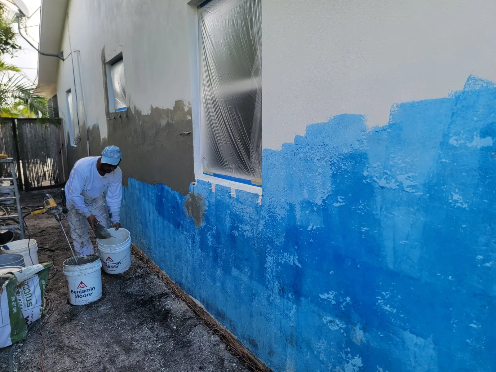 Stucco surface preparation in progress