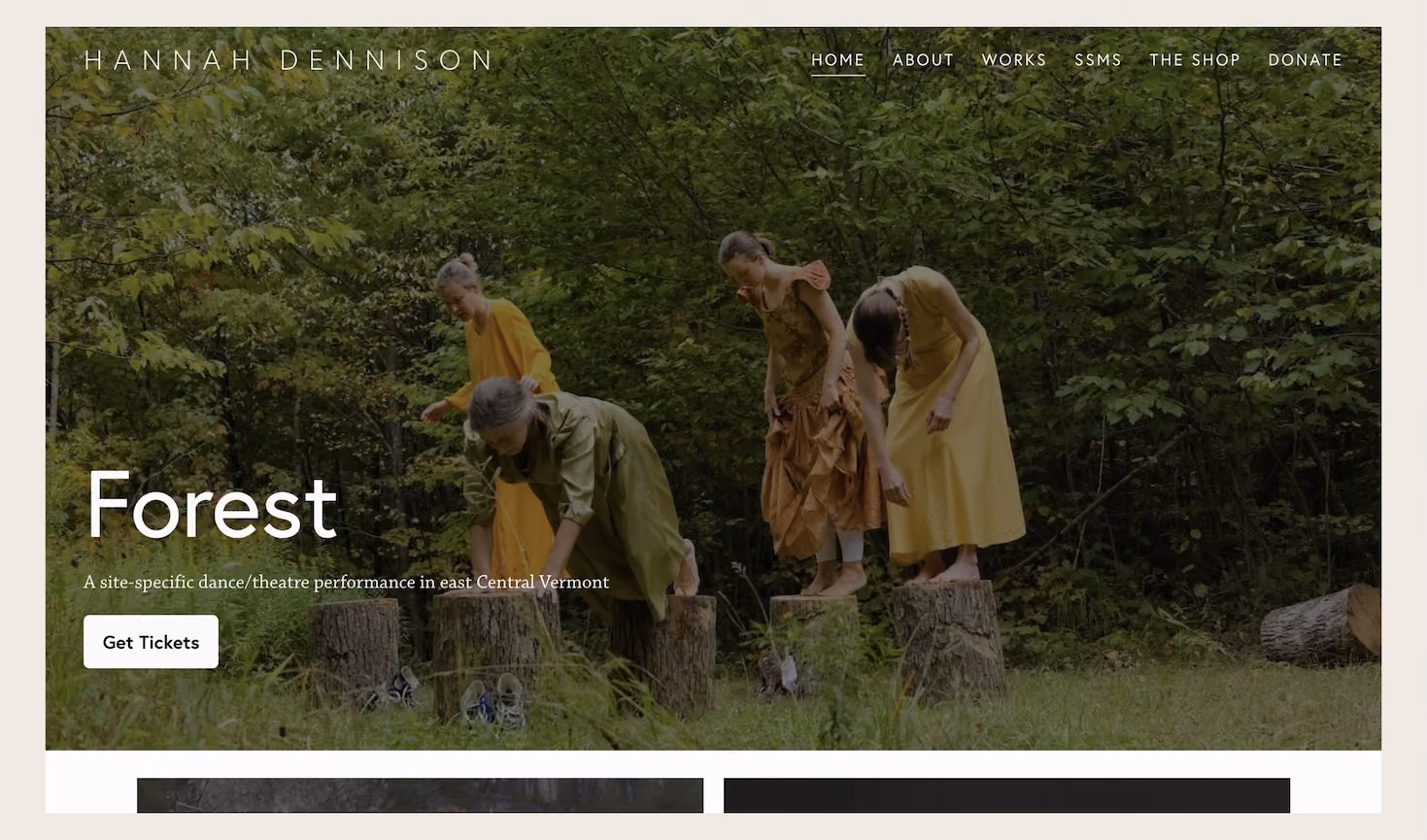 Website homepage banner showing four people dressed in earth-toned clothing standing and crouching on tree stumps in a forest clearing, with text 'Forest' and 'A site-specific dance/theatre performance in east Central Vermont' and a button labeled 'Get Tickets'.