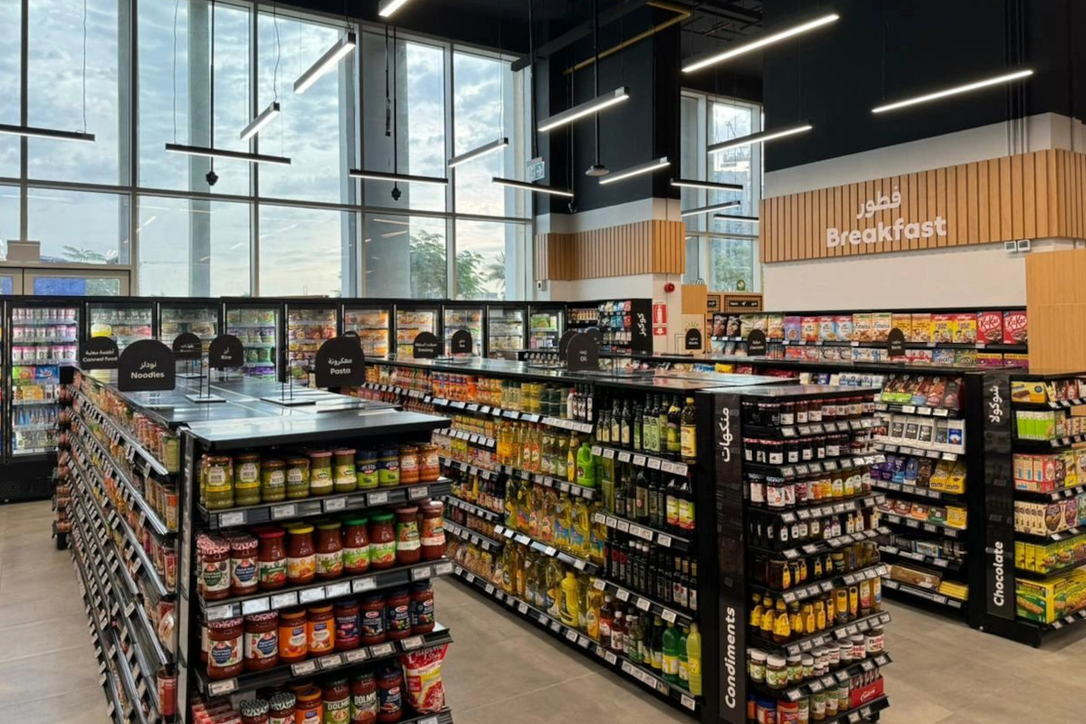 Supermarket grocery aisles displaying packaged food products across multiple categories