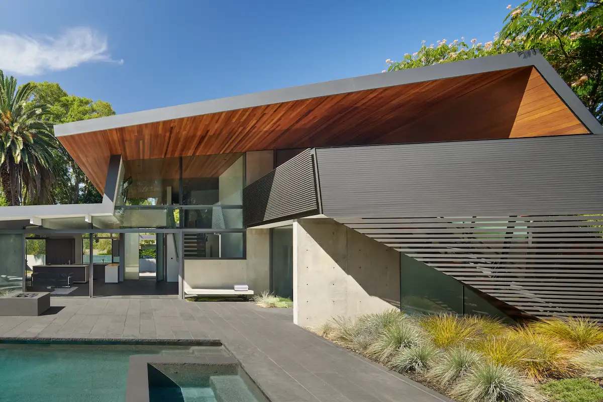 Edgewood Drive new build featuring a modern architectural home with wood ceilings, large windows, and a swimming pool.