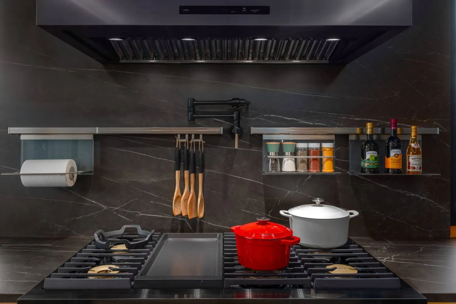 Luxury modern kitchen remodel and addition in Palo Alto featuring custom cabinetry, high-end appliances, and marble countertops.