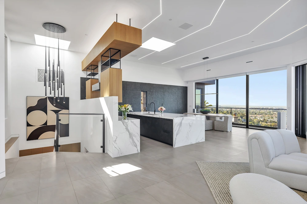 A contemporary hillside residence featuring clean lines, floor-to-ceiling glass, breathtaking views, and an elegant open layout.