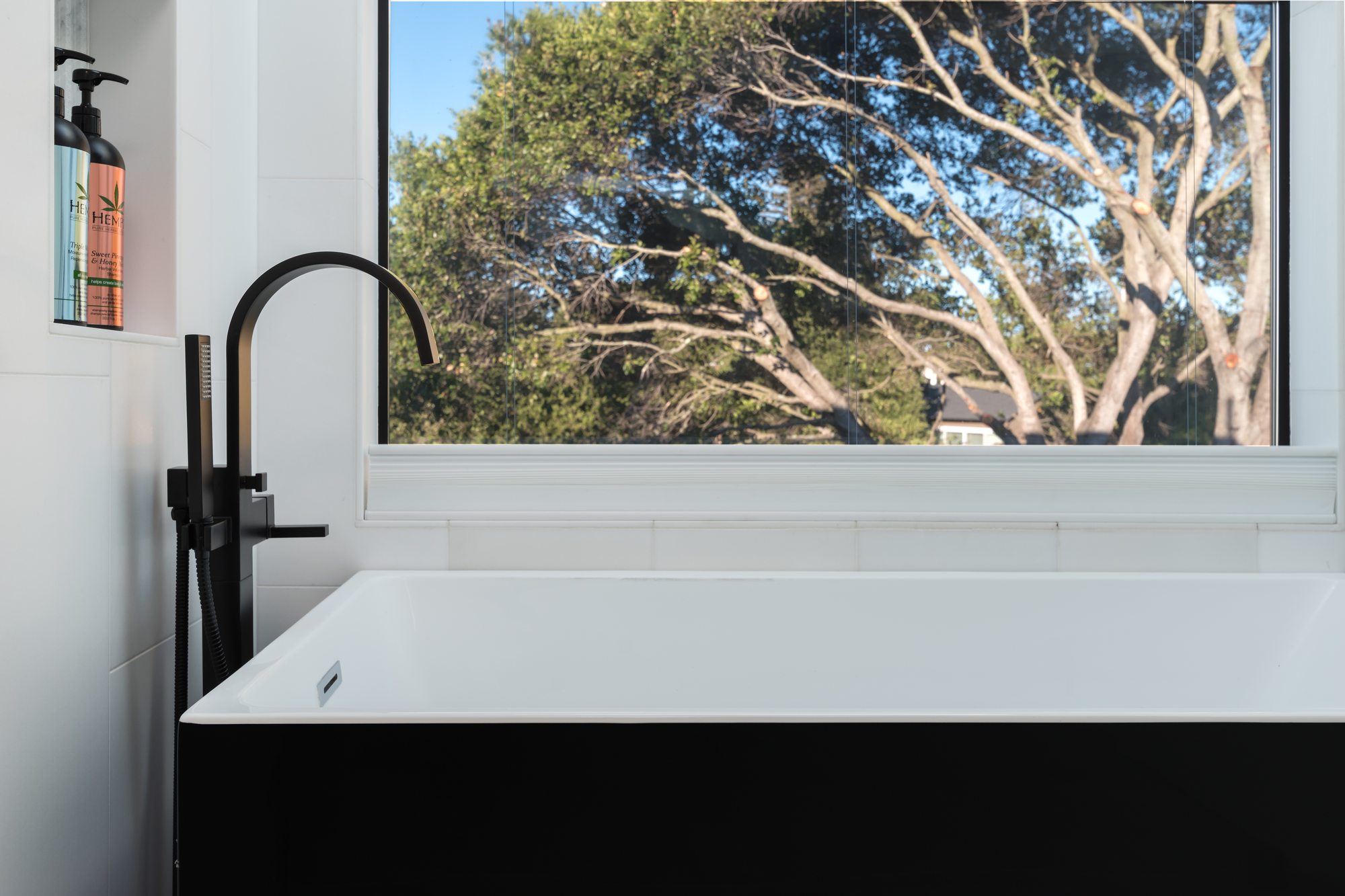 Thurm Avenue, a remodel in Belmont by Greenberg, a tub looking into the oaks