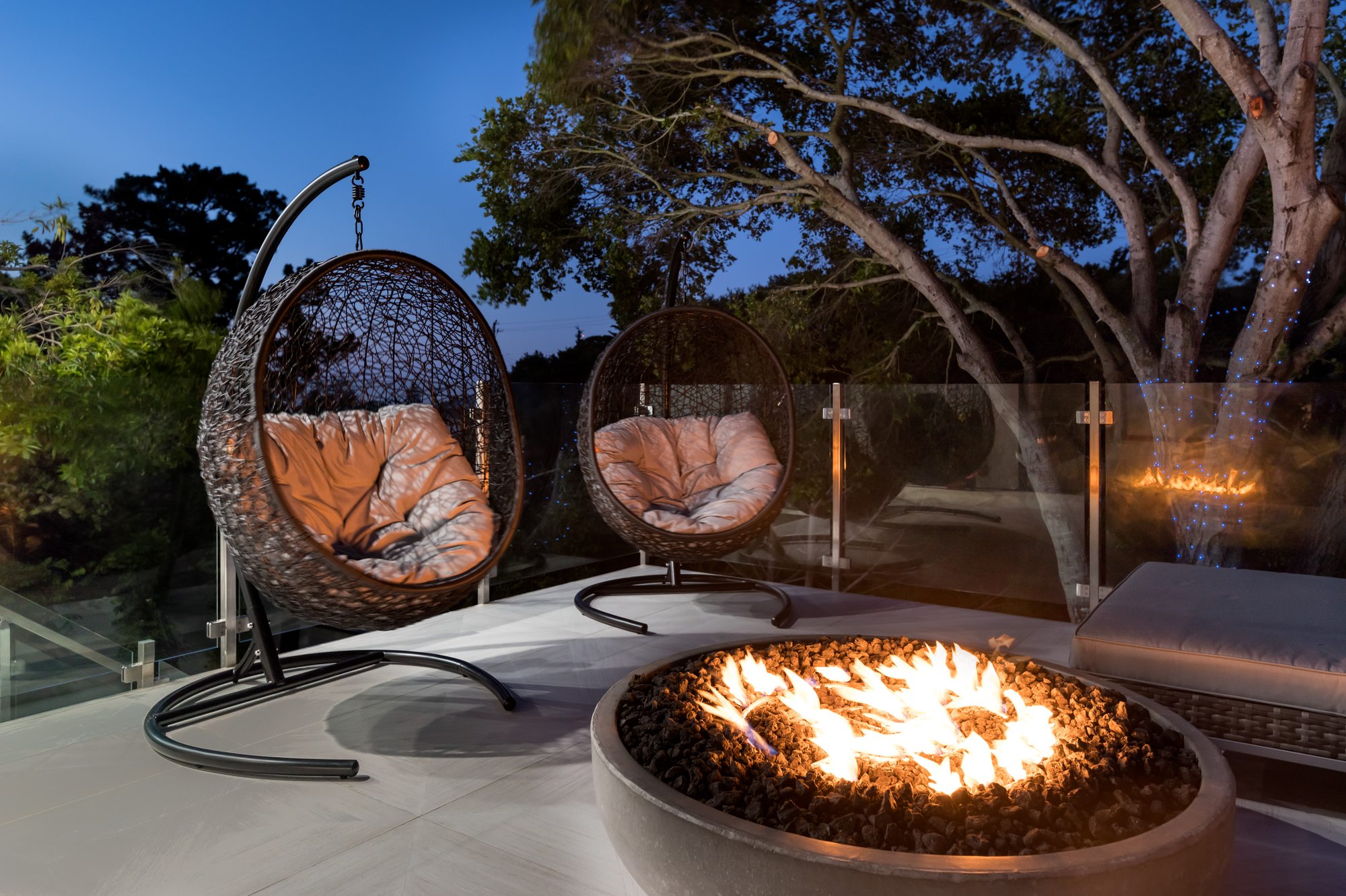 Thurm Avenue, a remodel in Belmont by Greenberg, the fire bowl and hanging chairs under the oaks