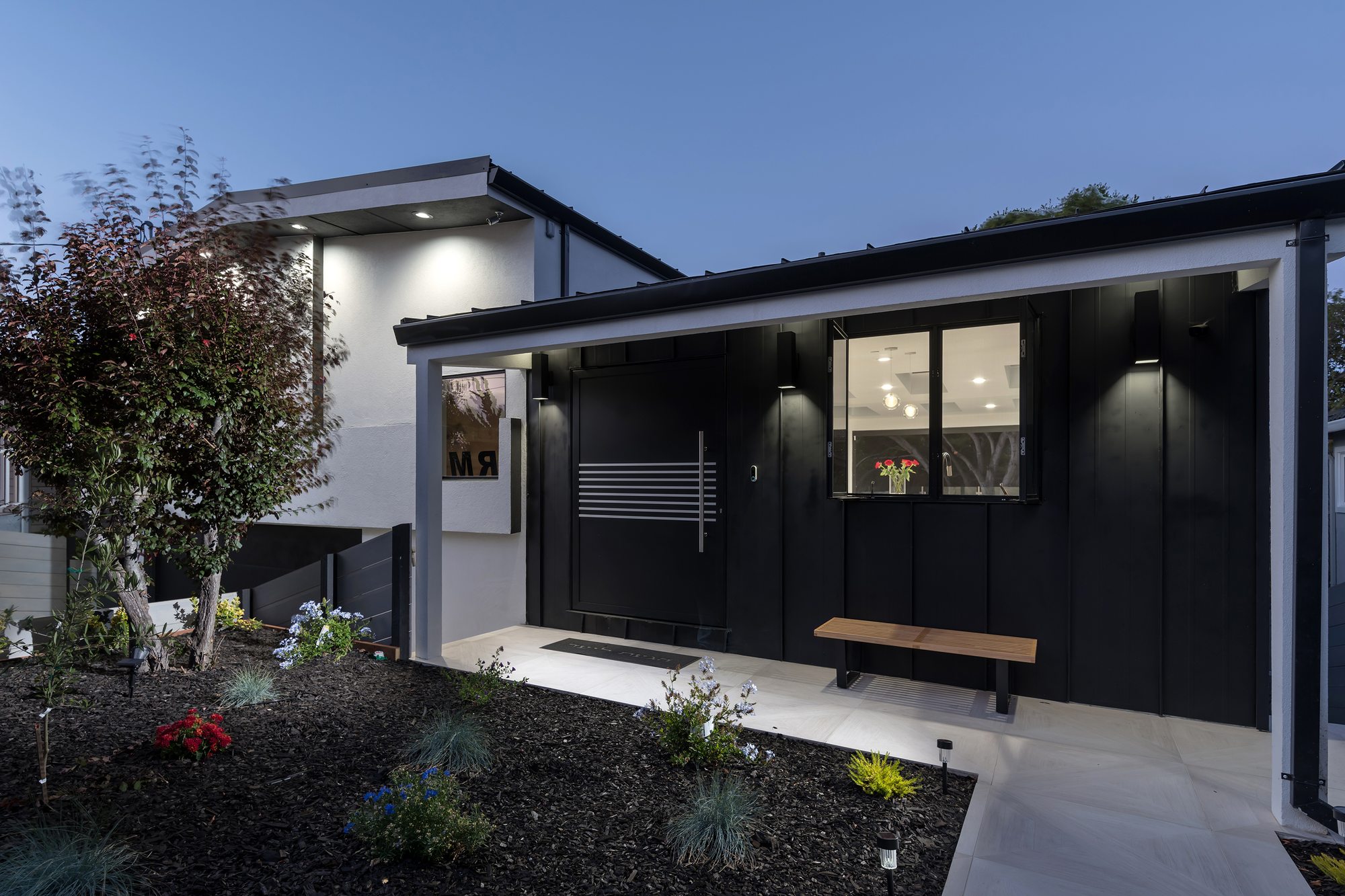 Thurm Avenue, a remodel in Belmont by Greenberg, the exterior at dusk