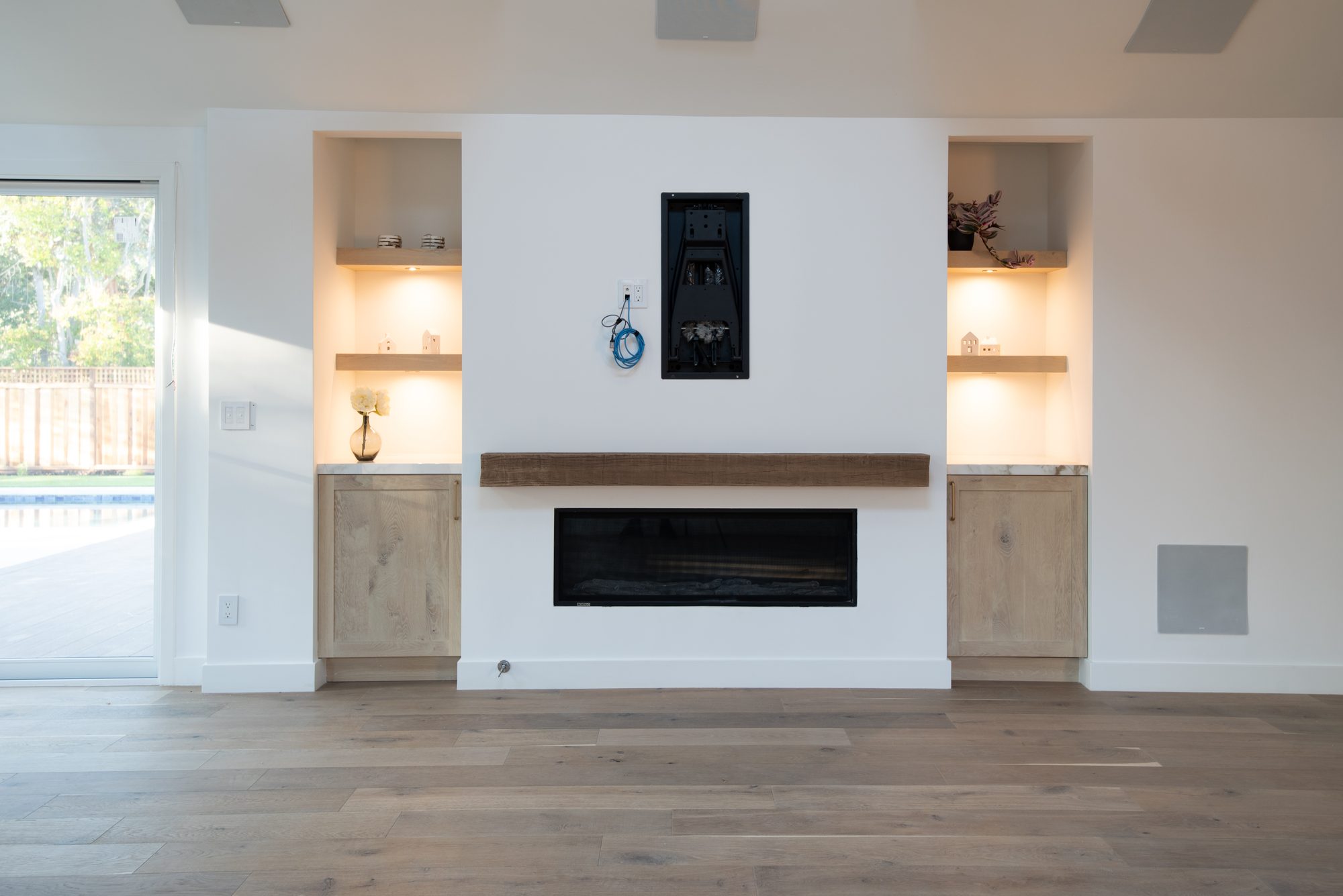 Springer, a remodel in Los Altos by Greenberg, the fireplace wall and oak built-ins
