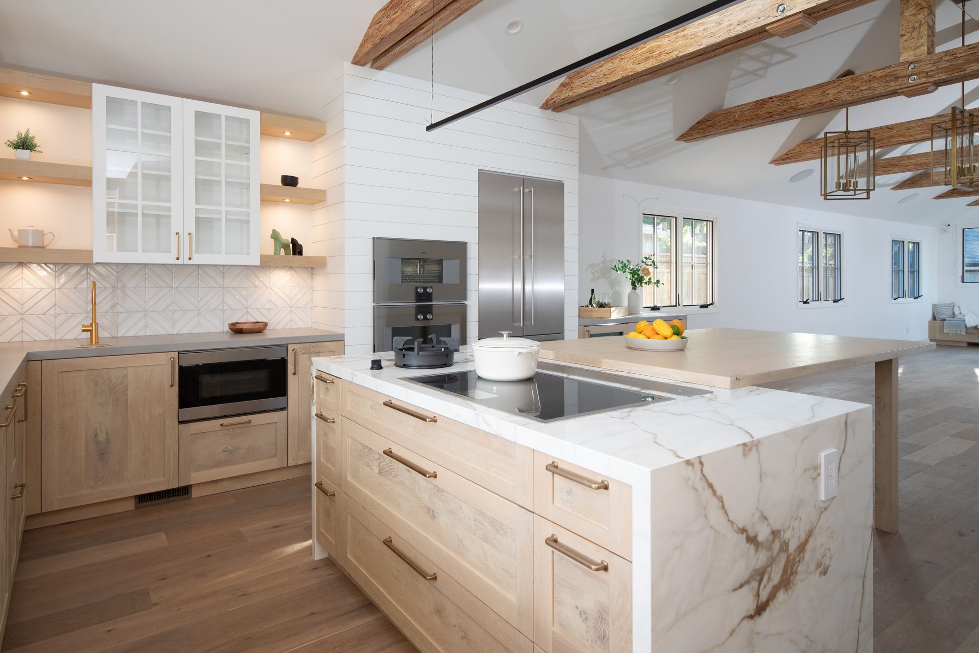 Springer, a remodel in Los Altos by Greenberg, the marble island and beams
