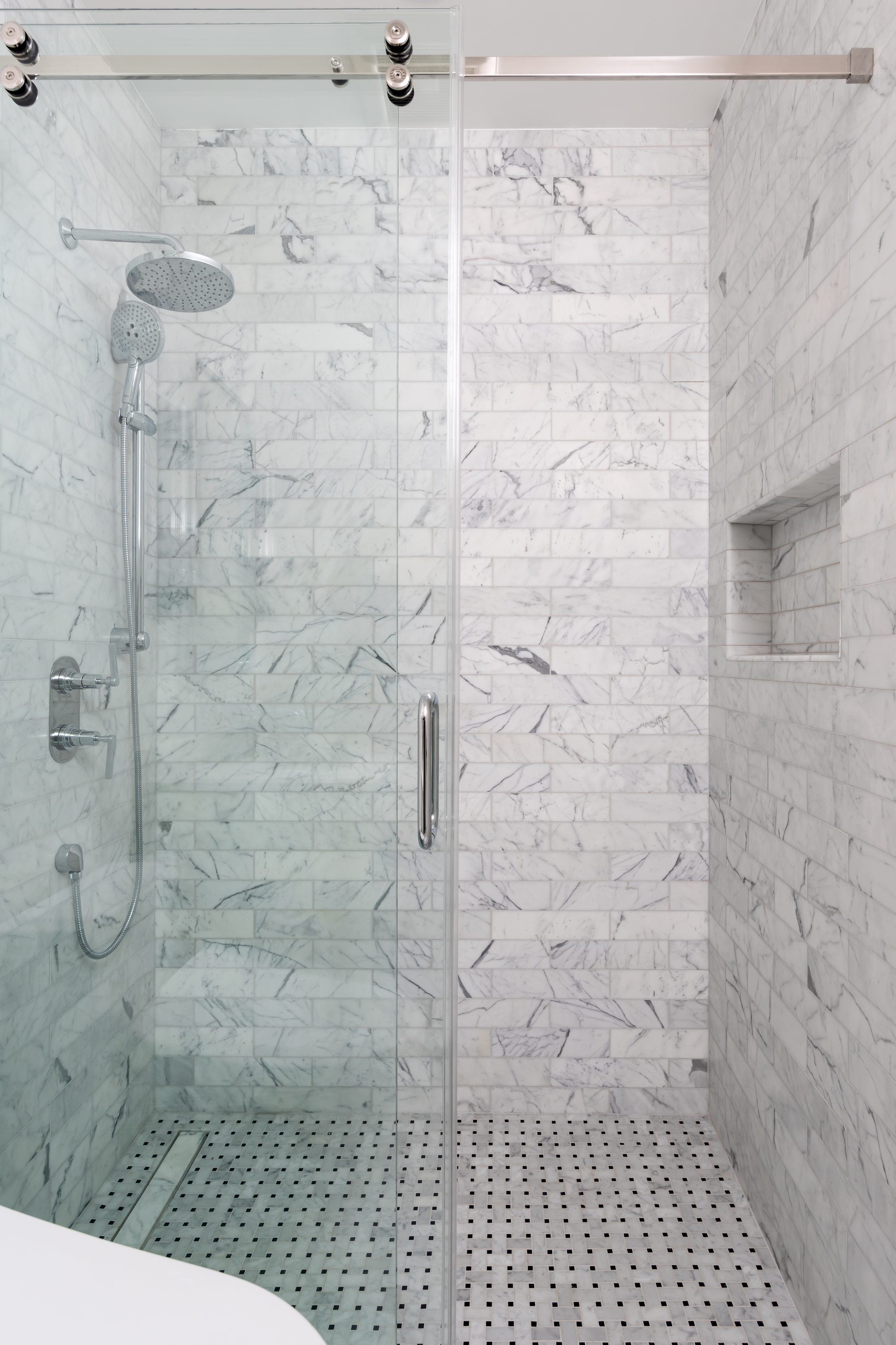 Amaranta Ave, a new build in Palo Alto by Greenberg, a marble-tiled shower stall