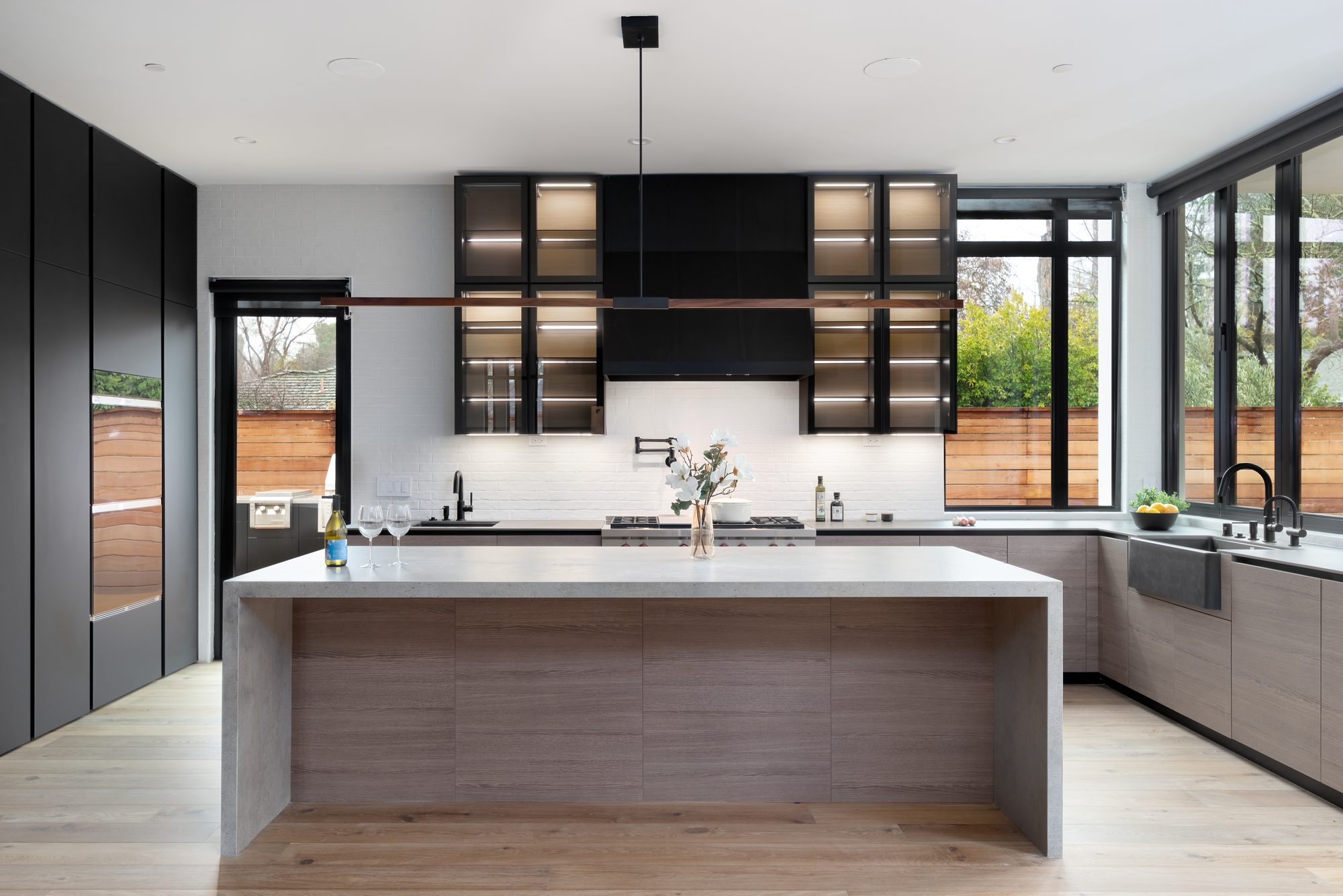 Stockbridge, a new build in Redwood City by Greenberg, the kitchen with black glass cabinetry