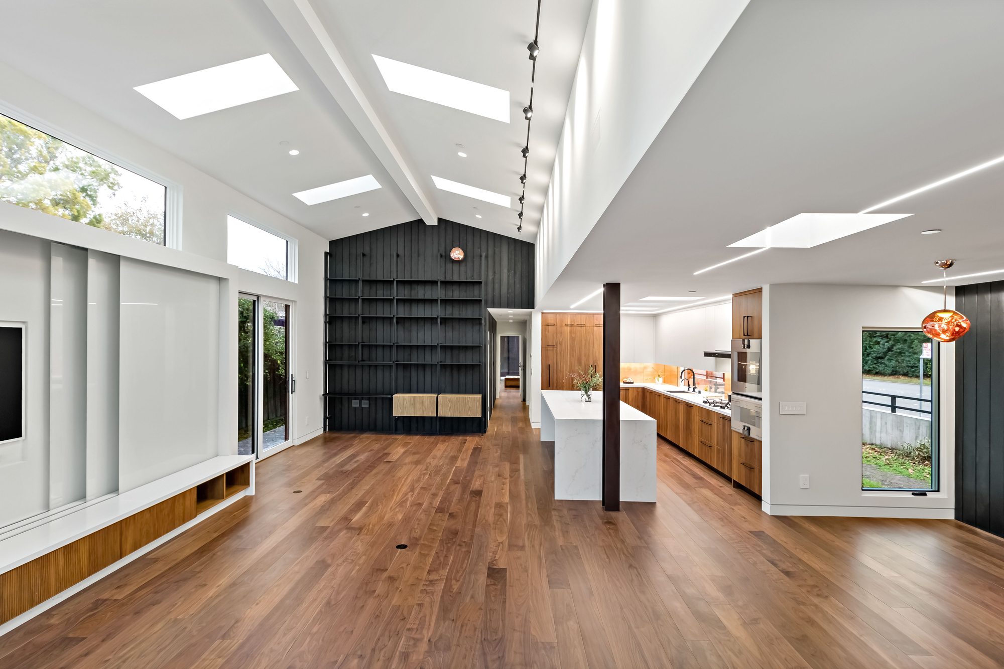 Santa Rita, a new build in Palo Alto by Greenberg, the hallway to the kitchen under skylights