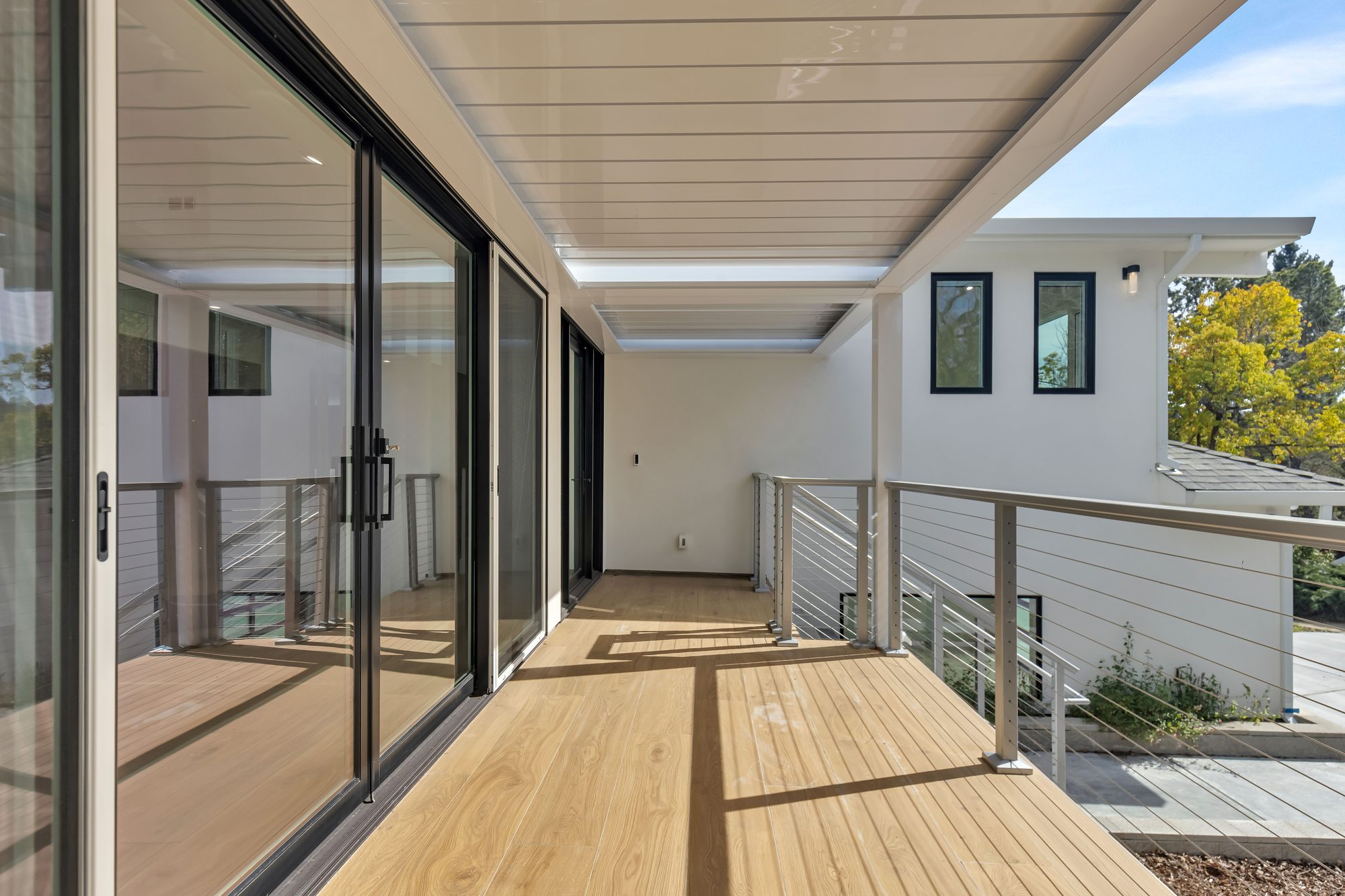 Westwood St, a remodel in Redwood City by Greenberg, the deck and its cable railing
