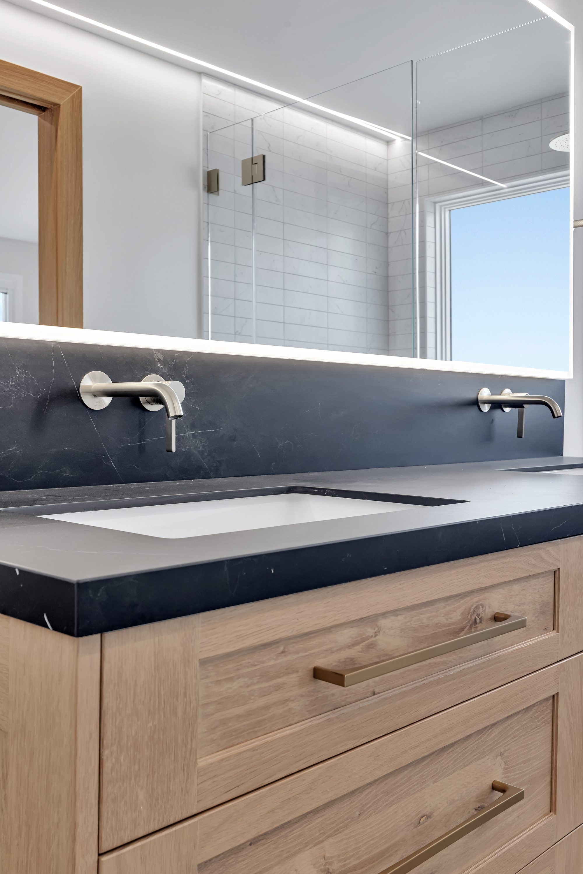 Westwood St, a remodel in Redwood City by Greenberg, the vanity and wall mounted taps