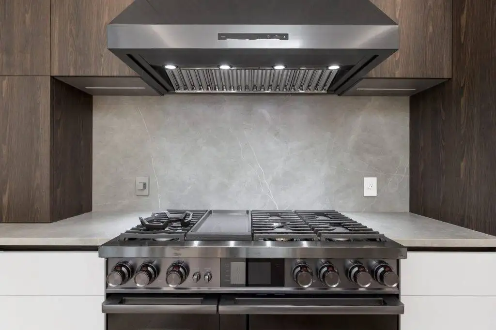 Range hood installed above a cooktop for kitchen ventilation