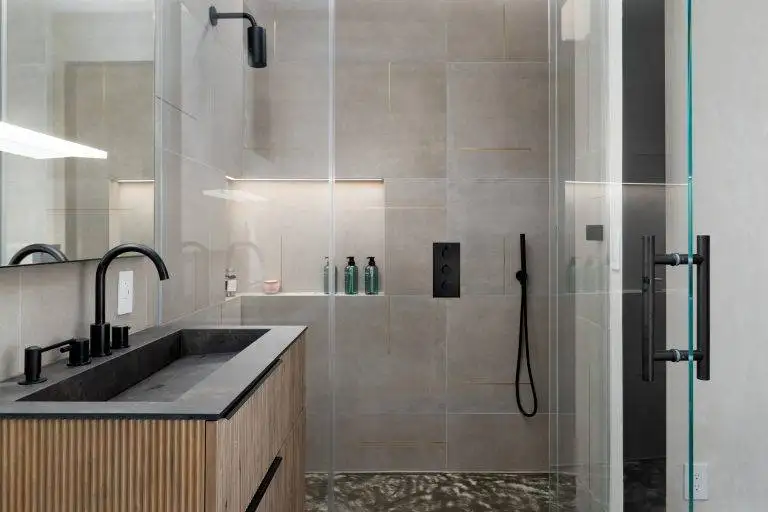 All the bathrooms feature tankless Axent toilets,epoxy resin sinks and curbless showers for easy access. Photo by Boaz Meri courtesy VRchitects.