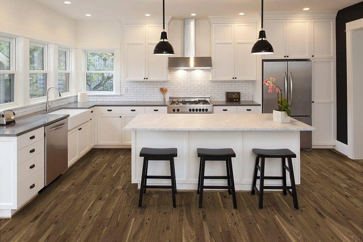 Hardwood flooring laid through a finished Greenberg kitchen
