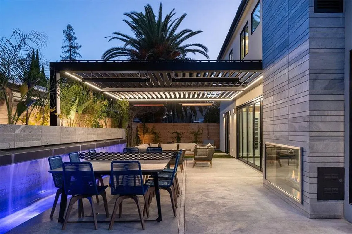 An outdoor kitchen and covered dining terrace built by Greenberg