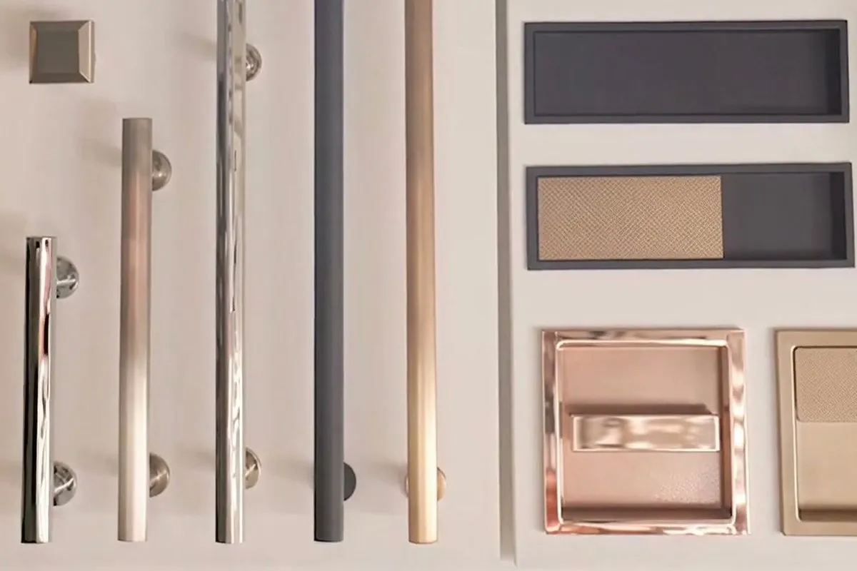 A hardware board in the showroom, pulls and flush pulls in brass, nickel, copper and matte black