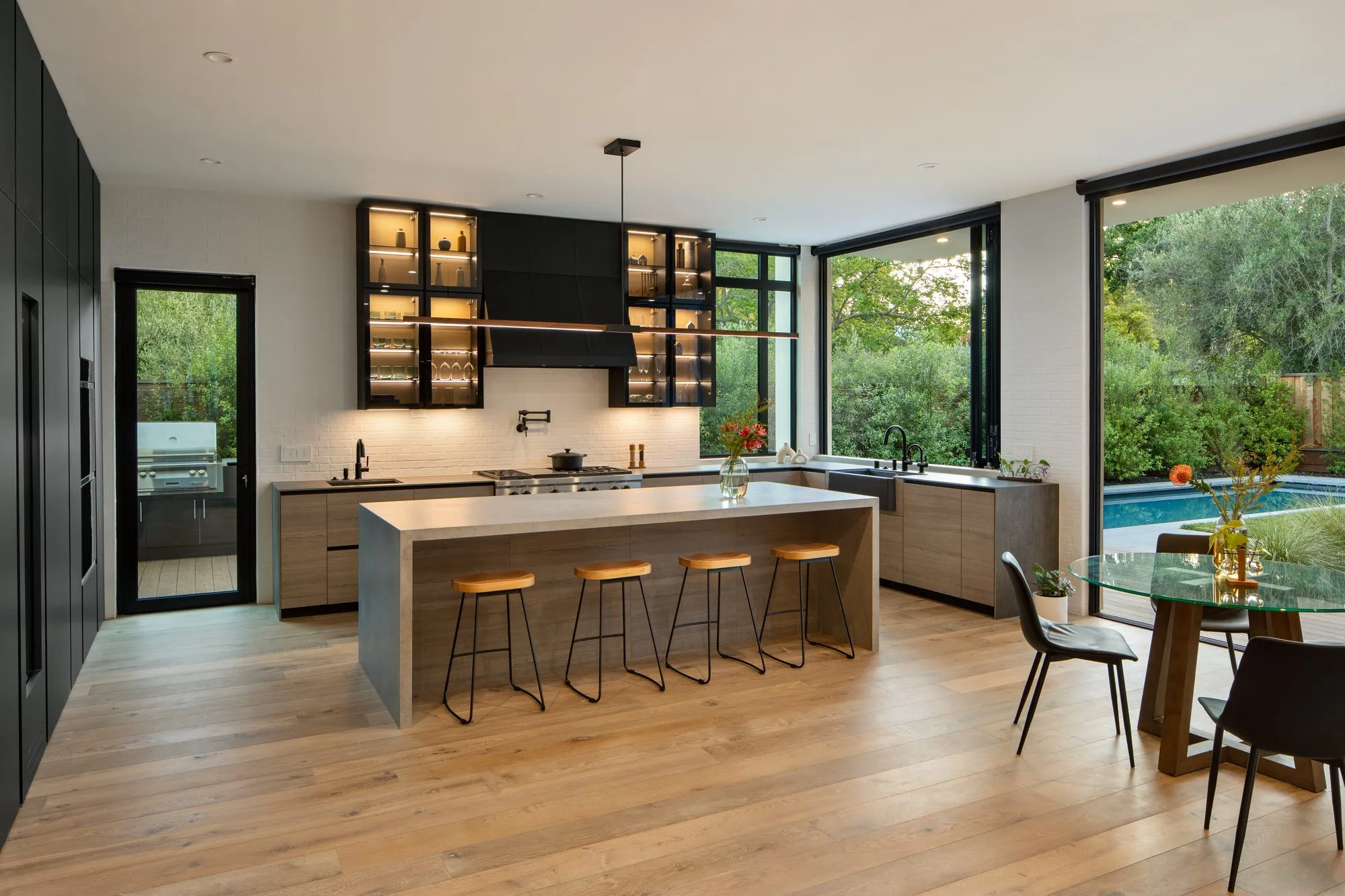 Stockbridge, a new build in Redwood City by Greenberg, the kitchen looking through to the pool