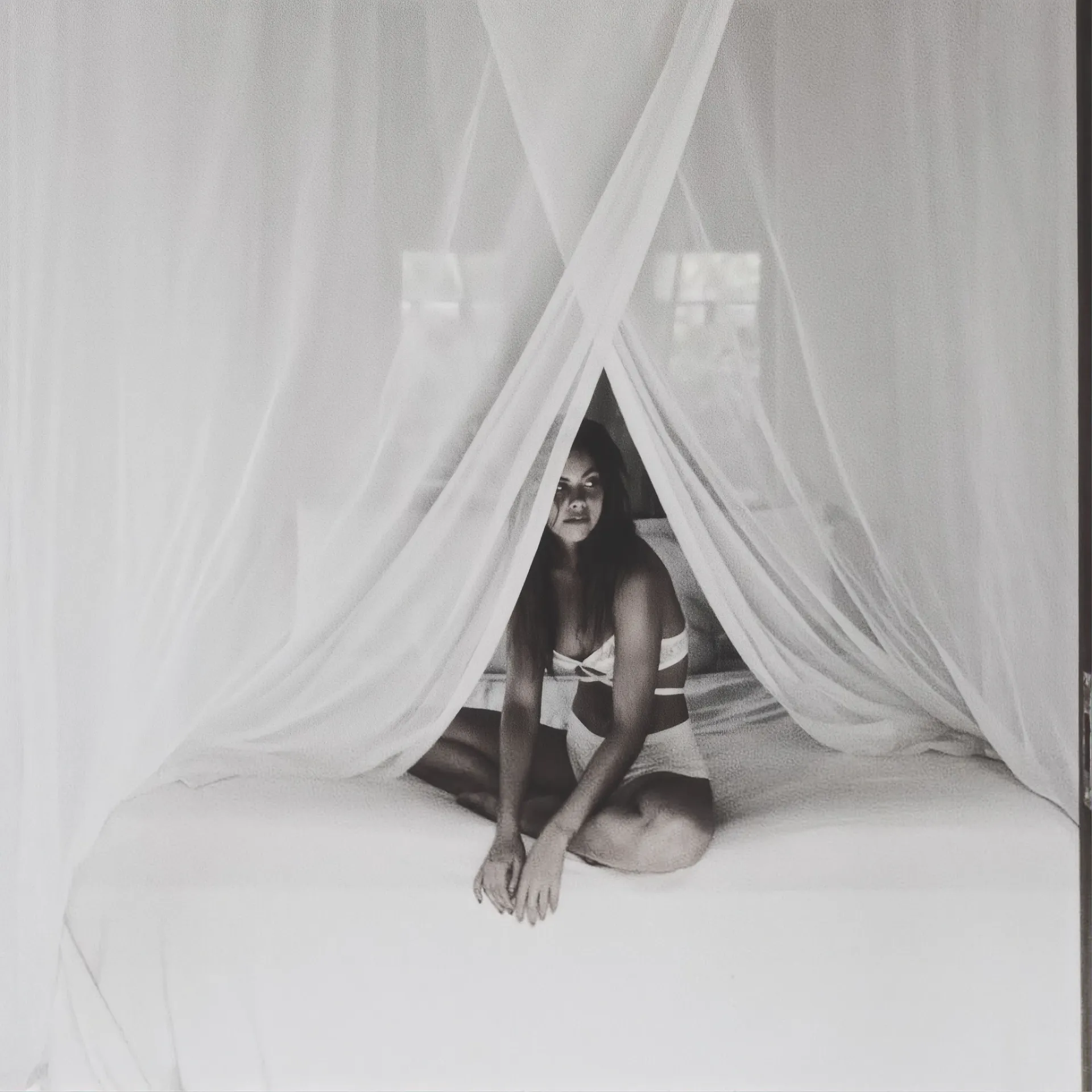 Guest seated inside the canopy netting