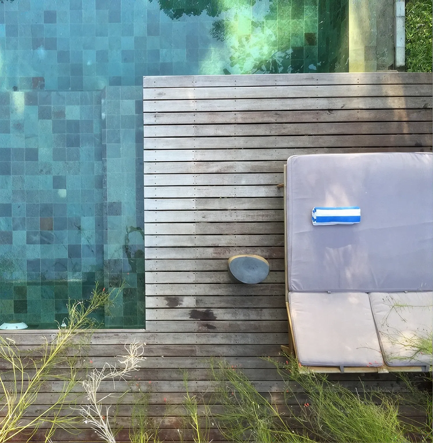 The 70 m² pool and its timber deck