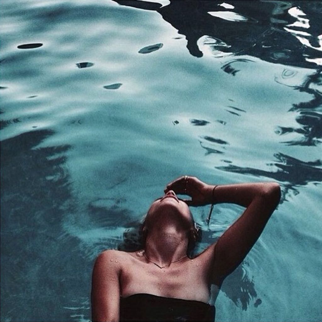 Swimming beneath the palms