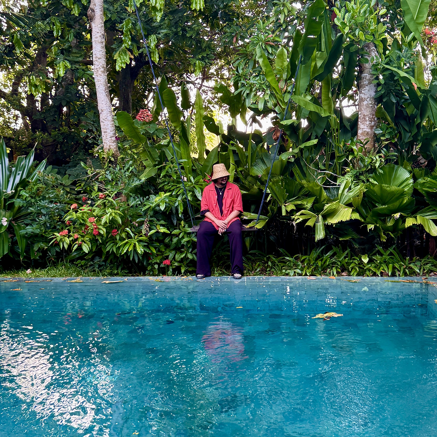 Guest seated at the poolside