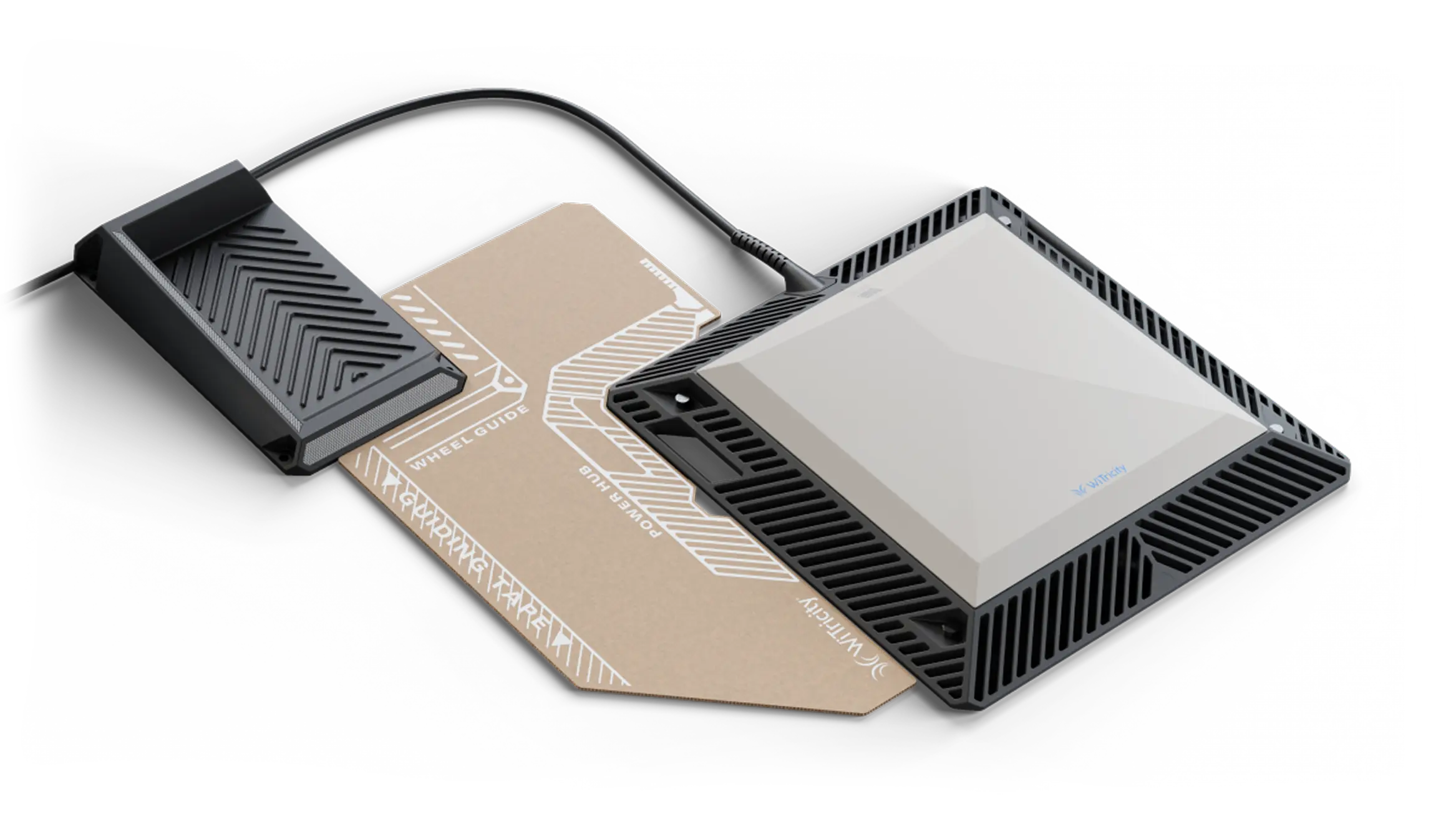 Wireless gaming router with a modern angular white and black design placed on a cardboard template labeled with wheel guide and power hub, connected to a black rectangular adapter via cable.