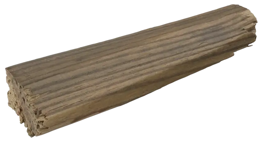 A bundle of tightly wrapped, thin brown sticks lying horizontally on a flat surface.