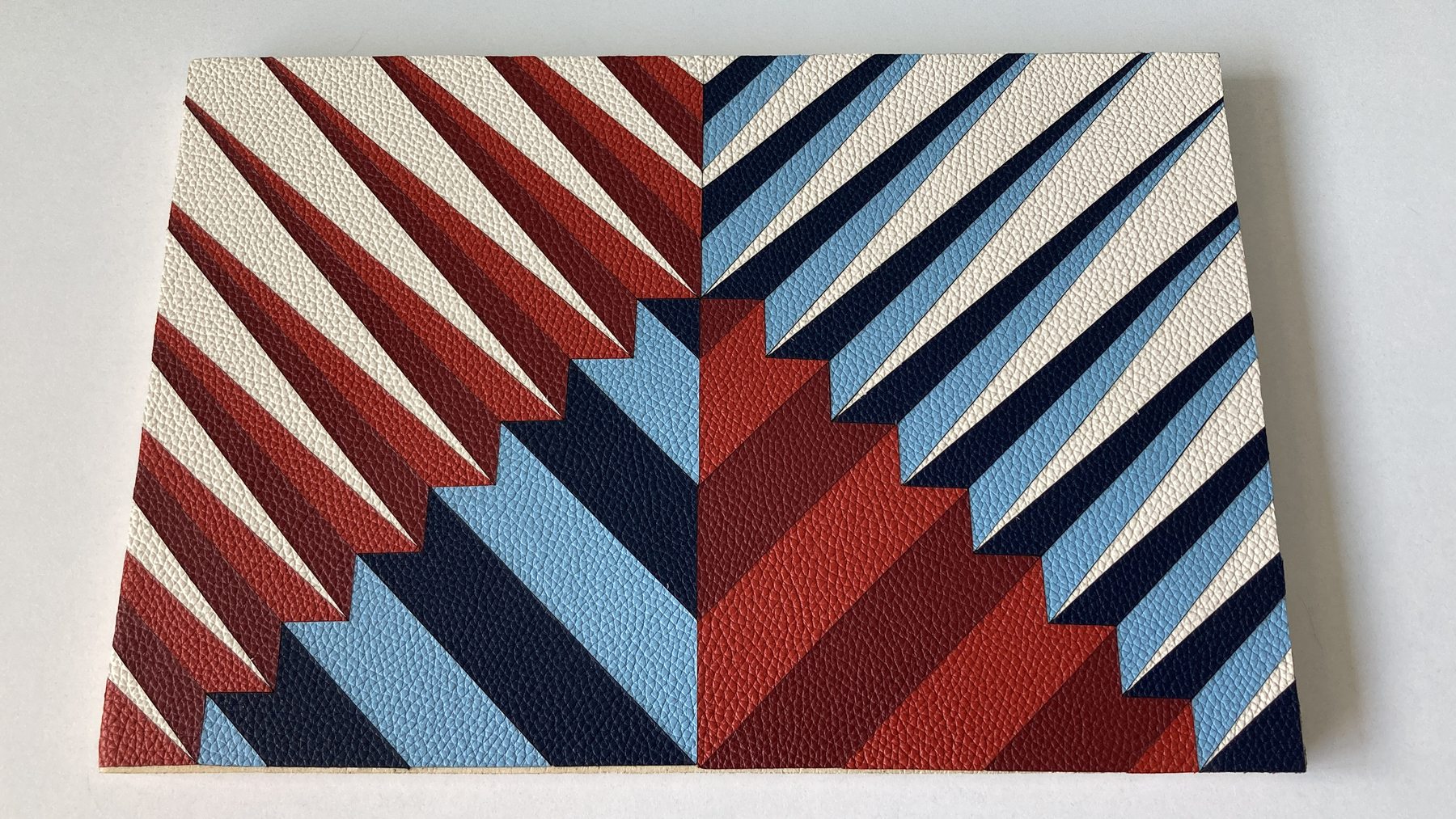 Red, white and blue geometric leather marquetry sample