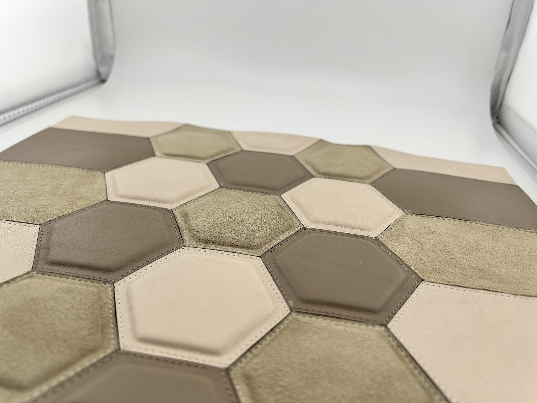 Stitched hexagonal leather and suede marquetry sample in neutral tones