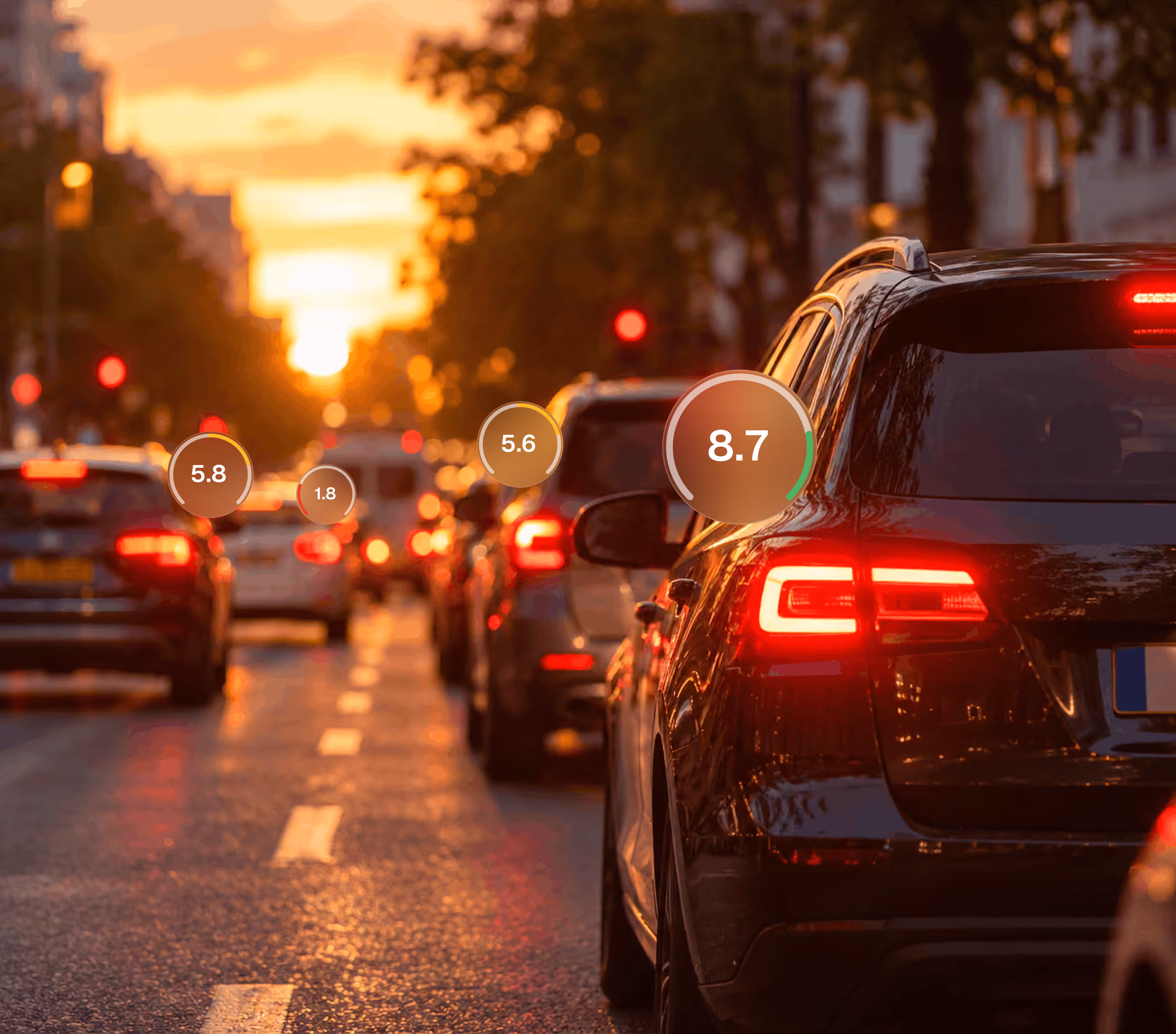 Rear view of a black sports car with illuminated red taillights parked on a city street during sunset with blurred traffic and street lights in the background.