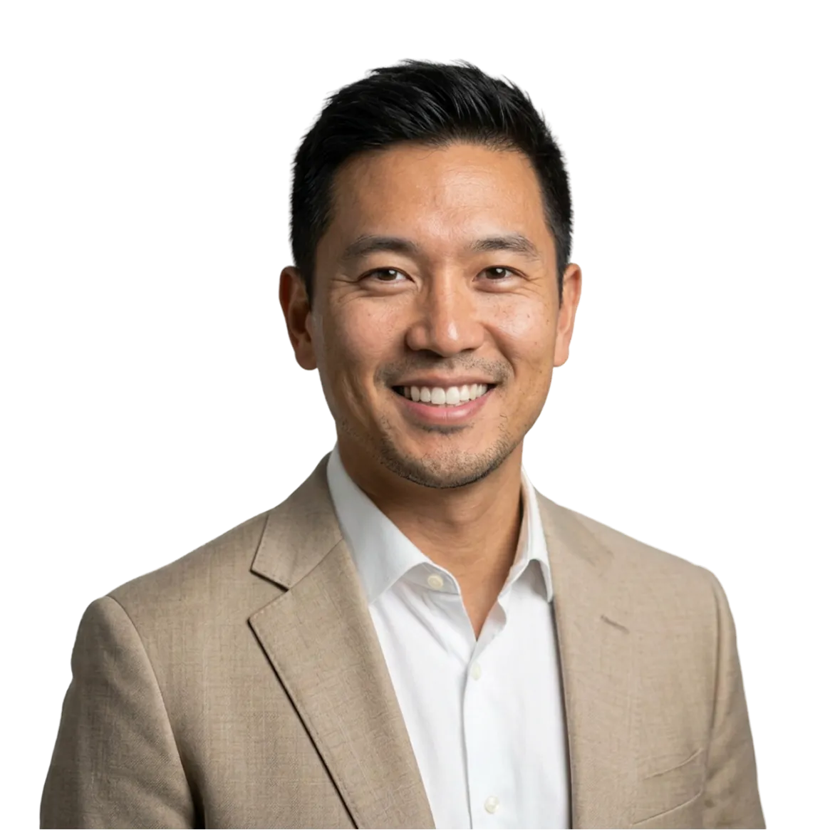 Smiling man with short black hair wearing a beige suit jacket over a white dress shirt.