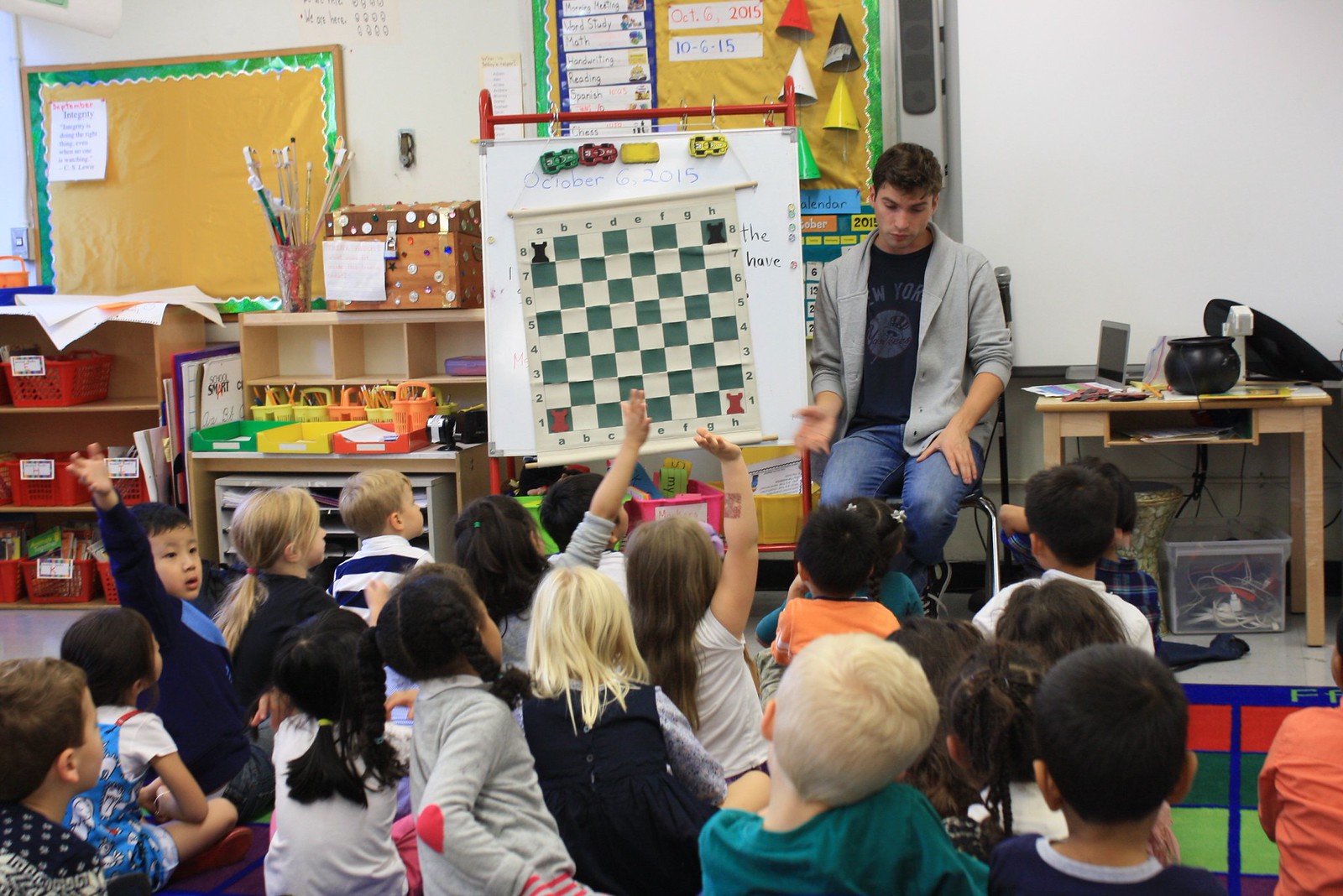 Ivan Dirkx teaching a chess lesson to an Anderson class